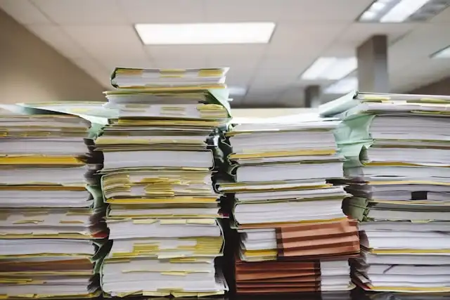 Stacks of shipping documents and paperwork used for customs clearance processing