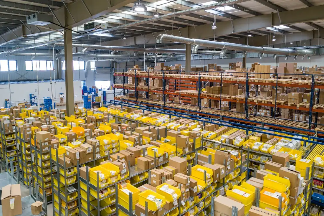 Warehouse worker sorting and handling parcels for shipment