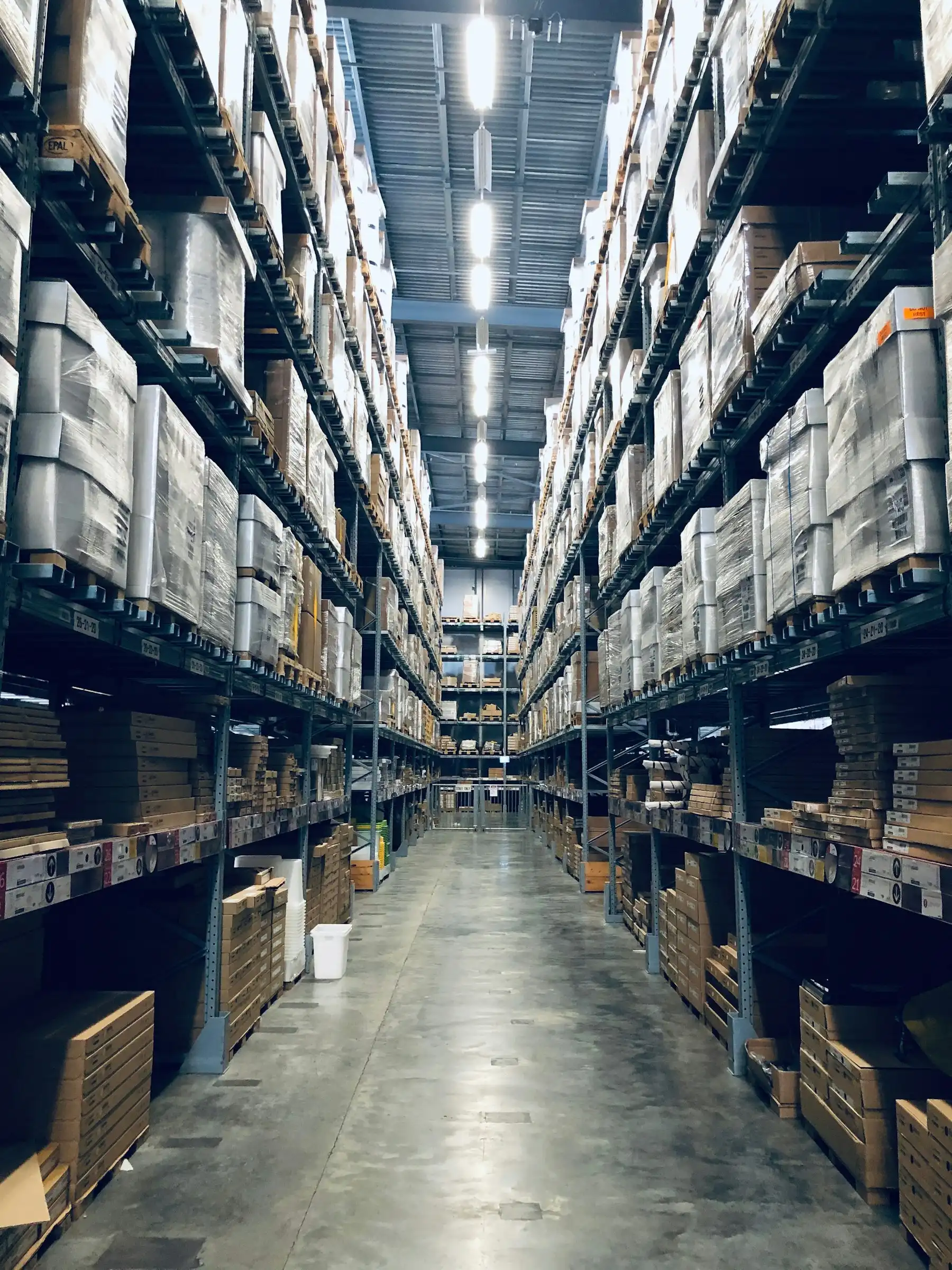 Warehouse storage aisle with inventory racks