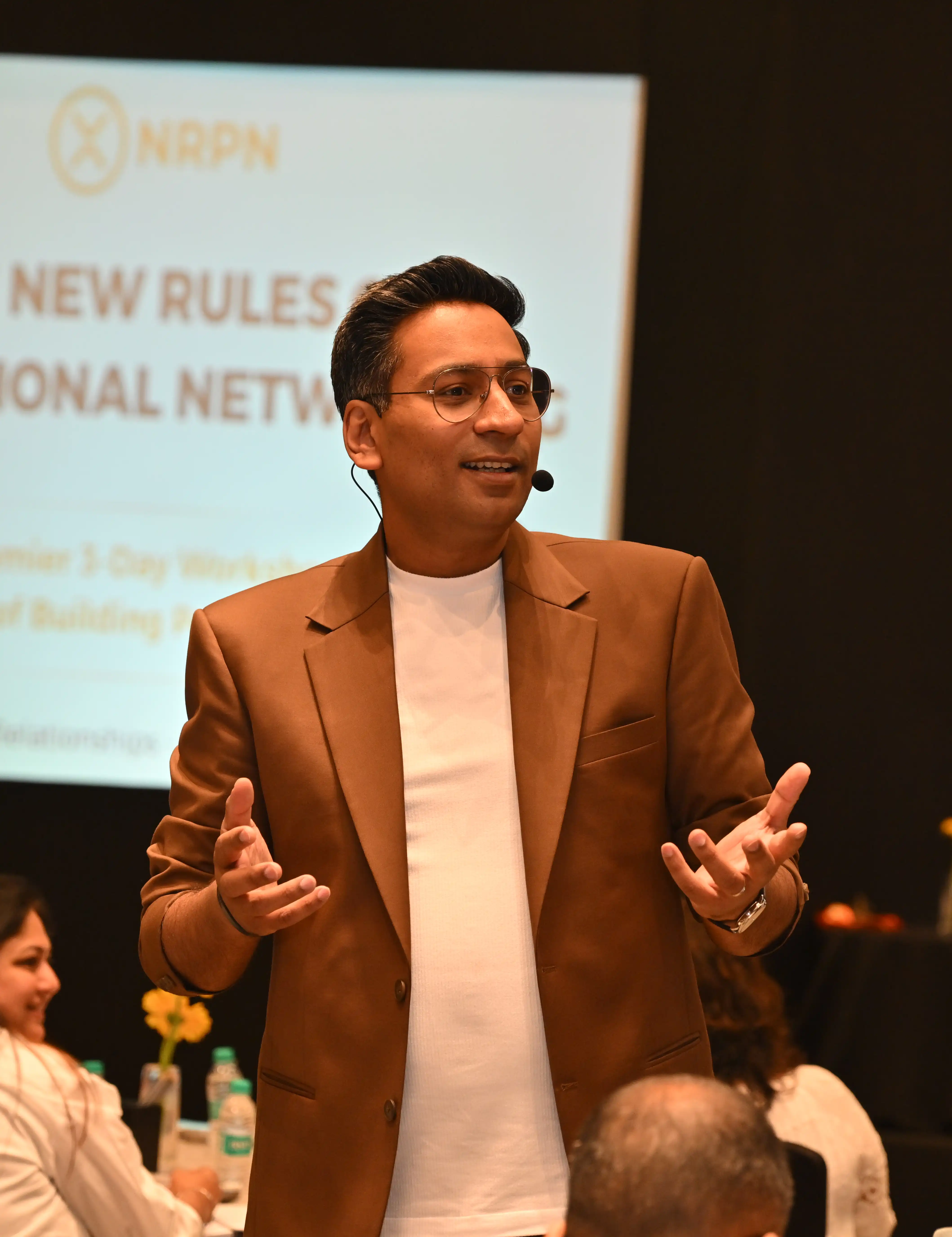 Paritosh Pathak speaking among NRPN participants