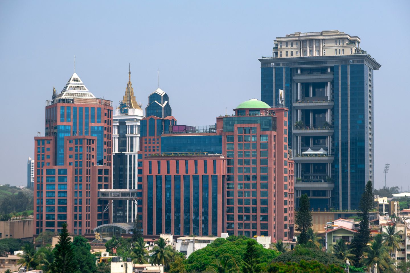 UB City rising above the tree canopy in central Bengaluru