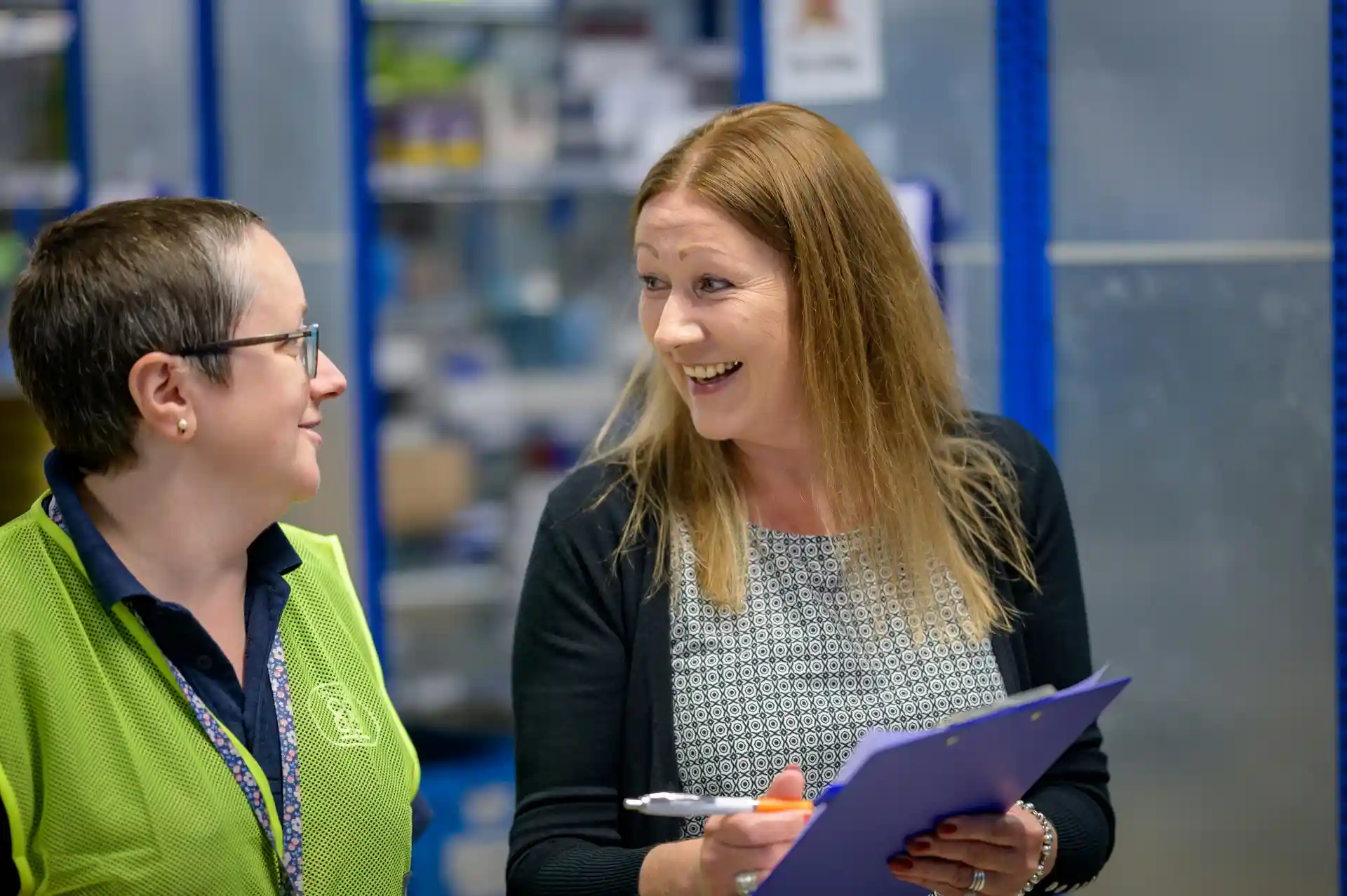 Team members working together in a warehouse